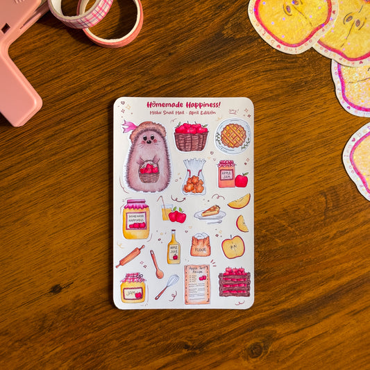 kawaii sticker sheet from the Mishu Snail Mail April Edition "Homemade Happiness", featuring Mishu the Hedgehog and hand-illustrated apple-themed designs on a wooden surface