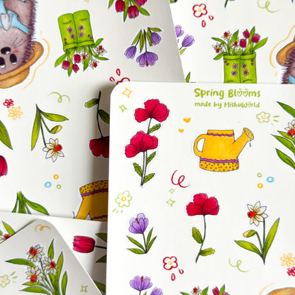 Spring-themed sticker sheets with flowers and gardening elements piled up.