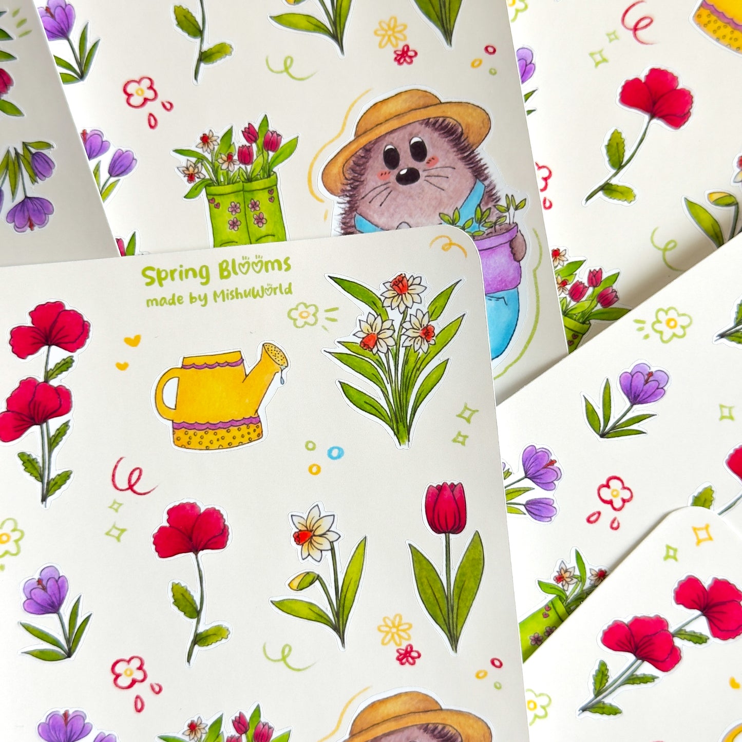 Details of a sticker sheet featuring a gardening hedgehog with gardening tools and flowers on a white background