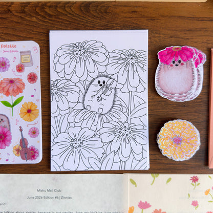 Coloring page with hedgehog and flower design on a wooden surface with decorative items.