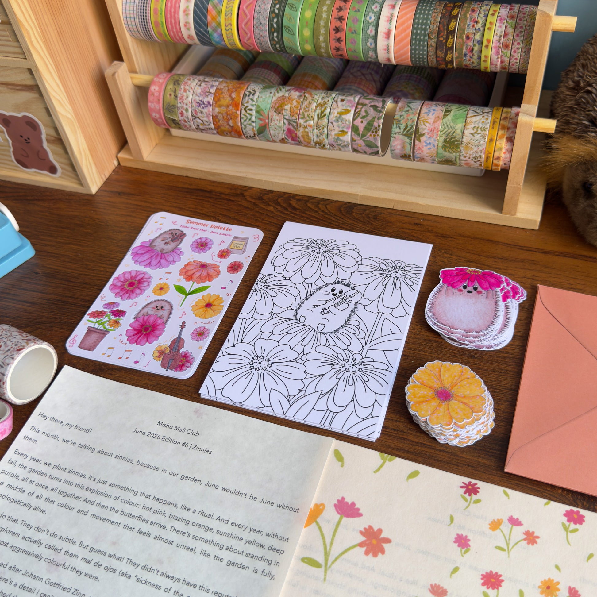 Coloring page, stickers, and washi tape on a wooden surface