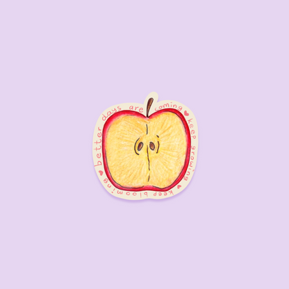 Sliced apple sticker with a motivational quote on a purple background